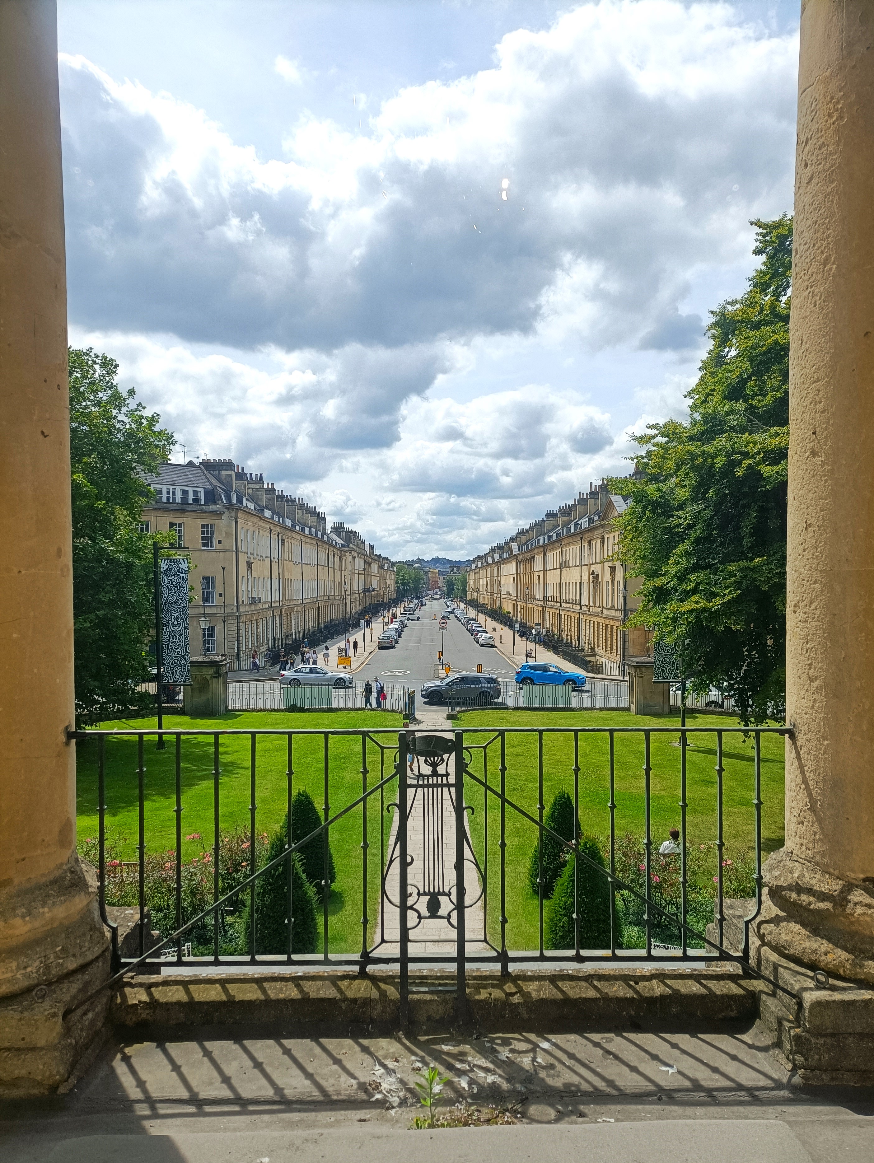 View of a straight road with buildings either side