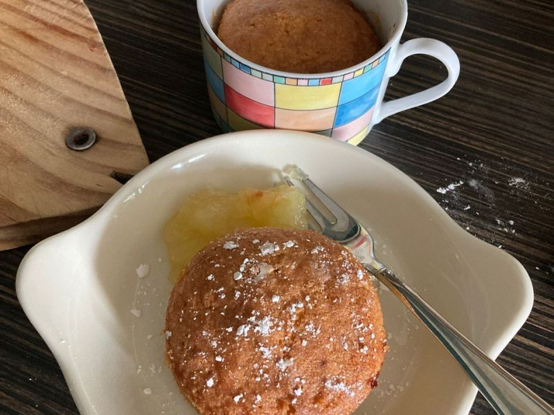  Photo of cake and a mug of tea.